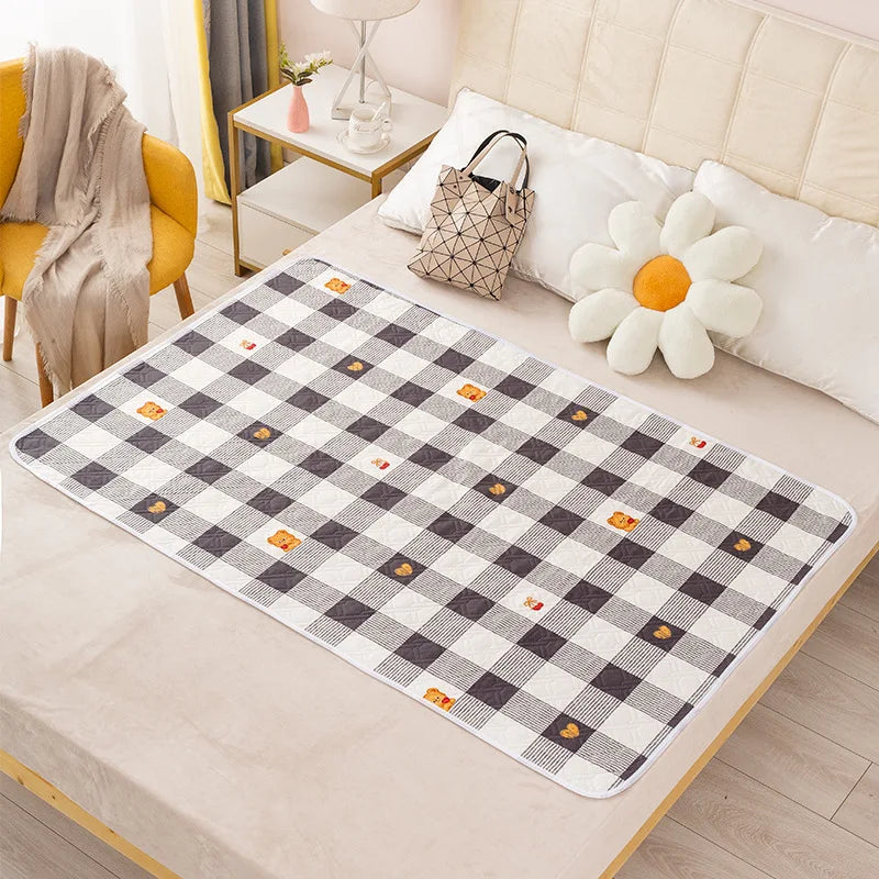 Alèse imperméable 50x70 cm motif damier noir et blanc