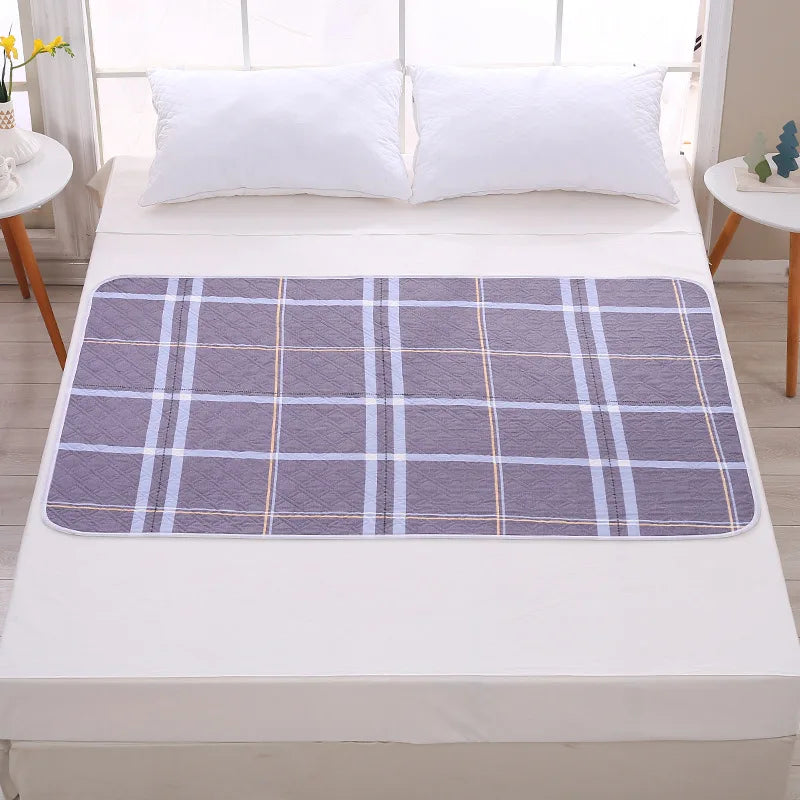 Alèse imperméable 50x70 cm motif carreaux gris-bleu