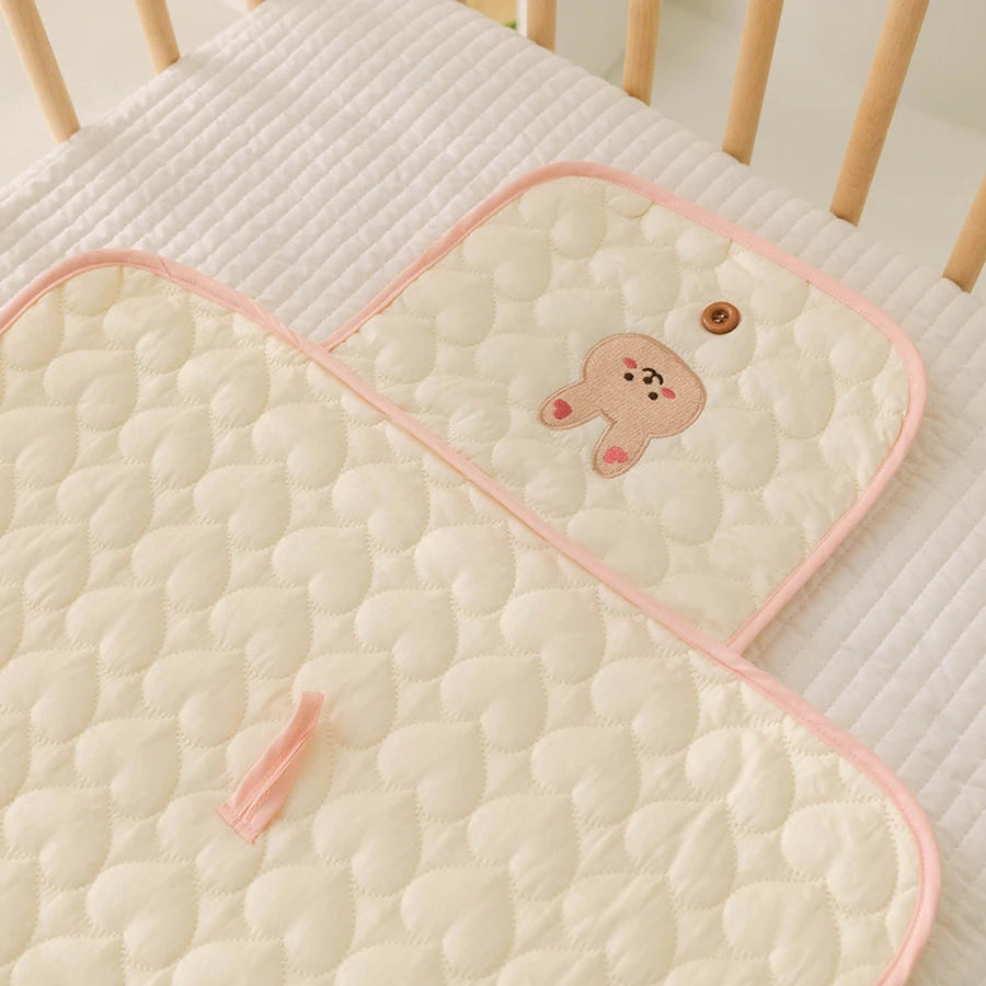 Matelas à langer — motif Lapin bordure rose